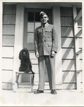 Photo: D.D. Bergie in RCAF Uniform Standing next to a Dog