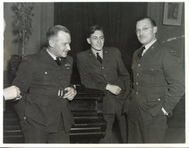 Photo: E.A. McNab Leaning on Piano During Blackout