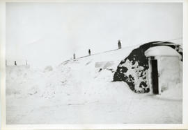 Photo: Arctic Scenery with Quonset Hut Covered in Snow