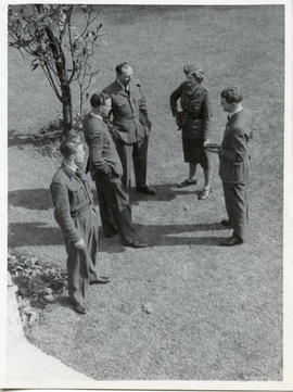 Photo: Airmen and an Airwoman Conversing in a Circle