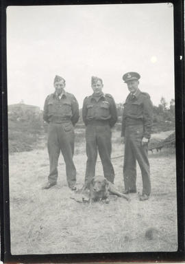 Photo: Three Airmen with Dog