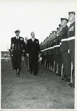 Photo: Civilian Inspecting RCAF Servicemen