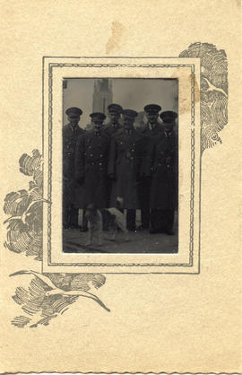 Photo: Airmen Posed Together with Dog