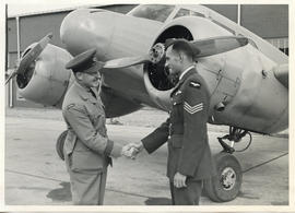 Photo: E.A. McNab Shaking Hands with RCAF Sergent