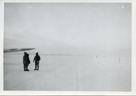 Photo: Arctic Runway with Three Men and Airplane Wing